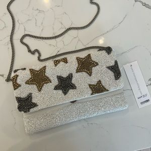 NWT White clutch/ crossbody, with gold and silver beaded stars